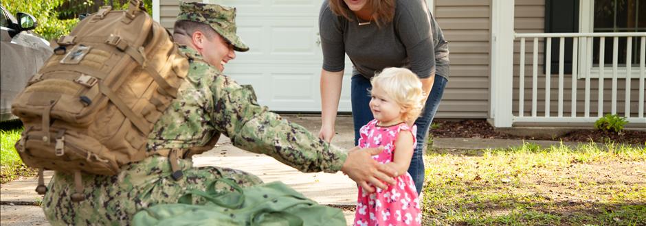 baby seeing military dad