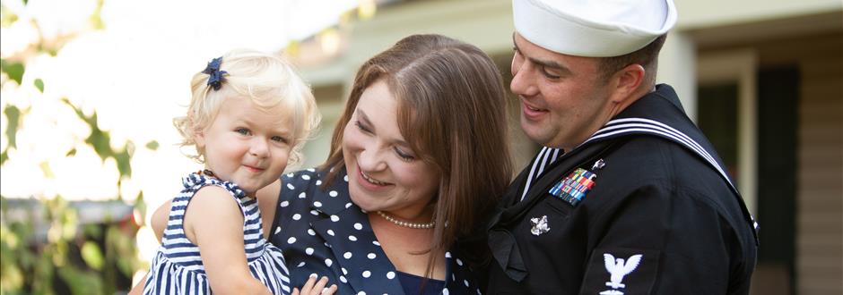 couple posing with child