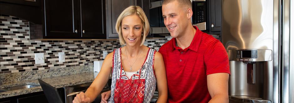 man and woman in kitchen 