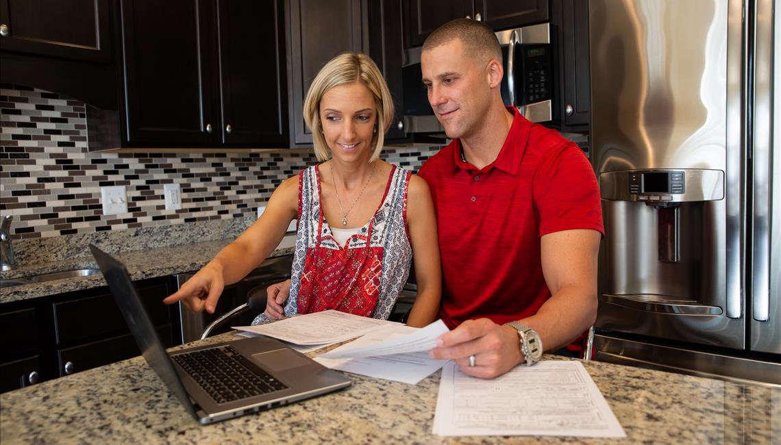 couple reading documents together