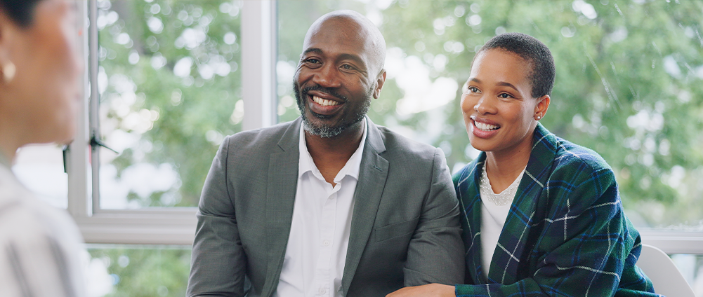 Military couple discussing trusts with AAFMAA Wealth Management & Trust LLC