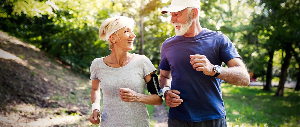 Woman and man jogging together.